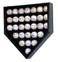 Black home plate-shaped display case with 30 signed baseballs on a white background