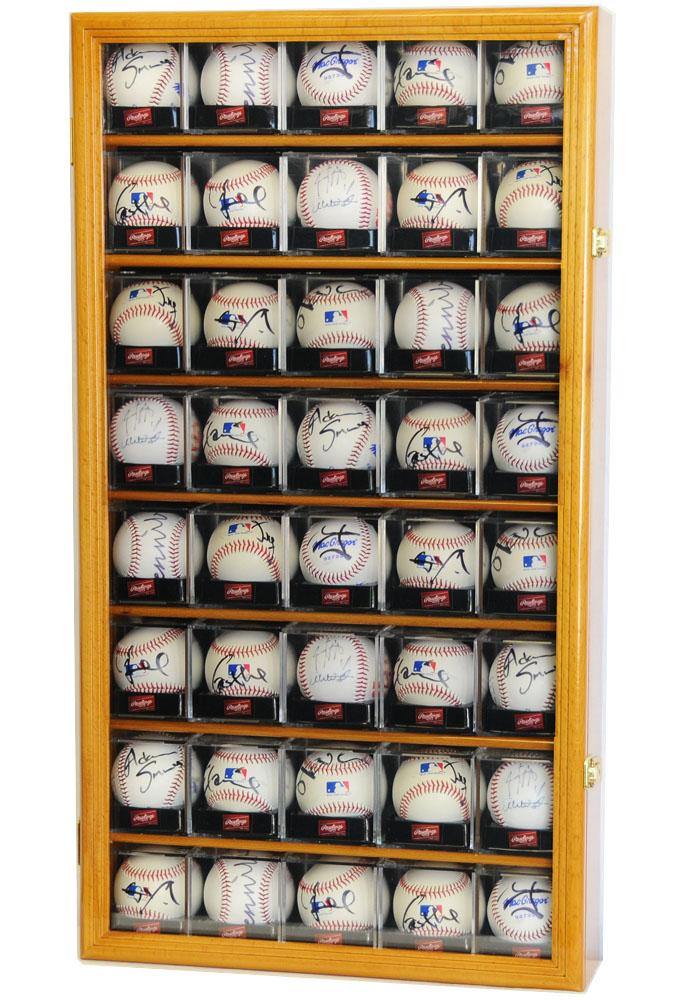 Wooden display case with locking UV glass door containing various cubed baseballs with autographs.