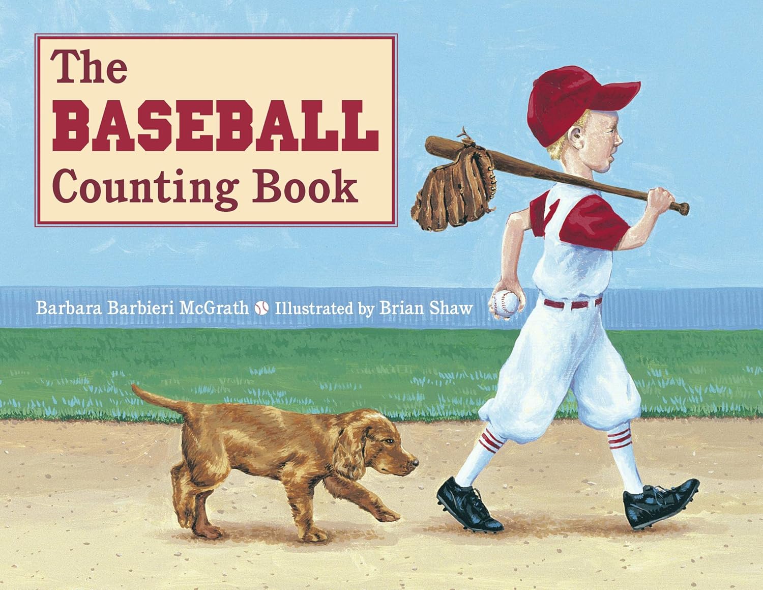 Paperback book cover of 'The Baseball Counting Book' with a boy in a baseball uniform and a dog on a baseball field.