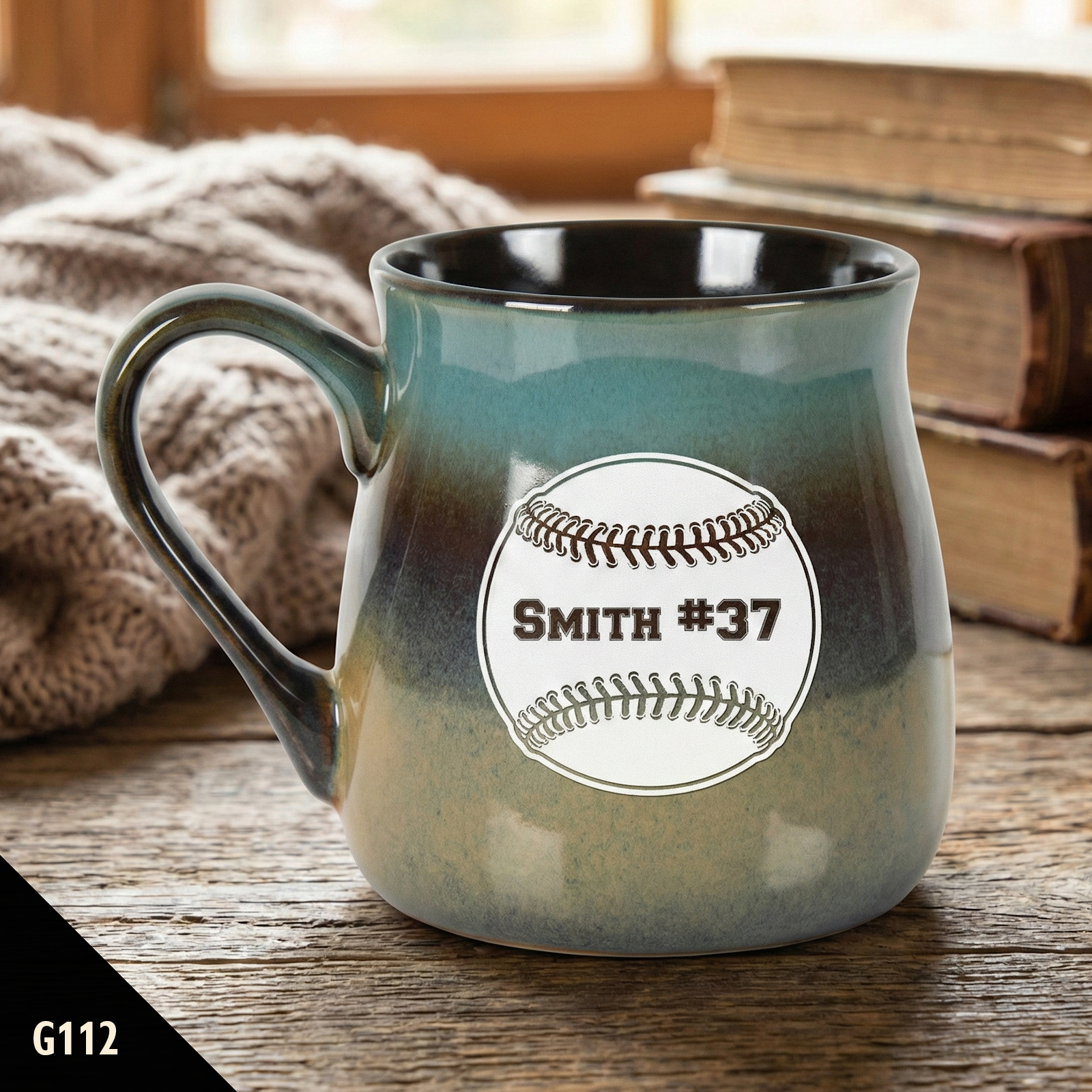 Teal rustic coffee mug with a baseball design and text on a wooden surface