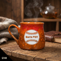 Orange Paris tavern ceramic coffee mug with a baseball design and text on a wooden surface.
