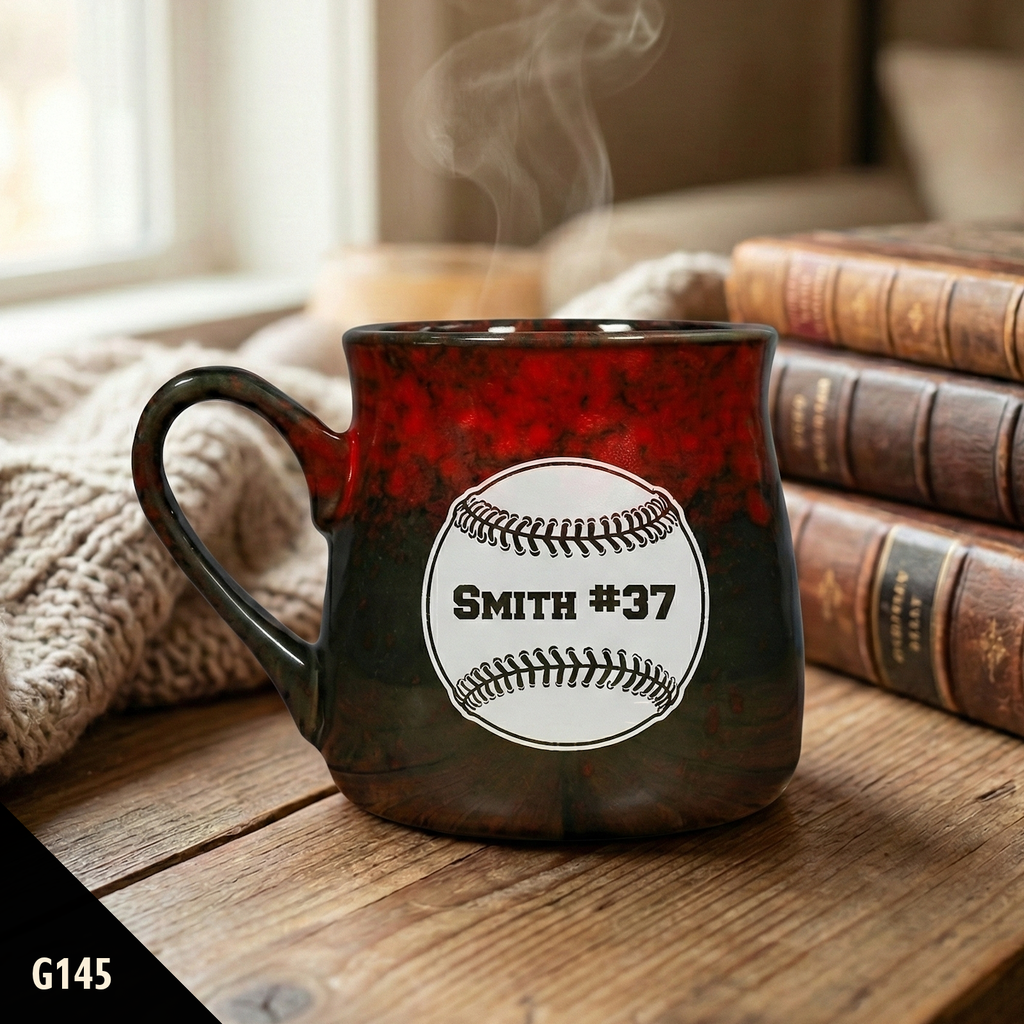 Ceramic Paris tavern coffee cup with personalized baseball design on a wooden surface with books and a blanket in the background.