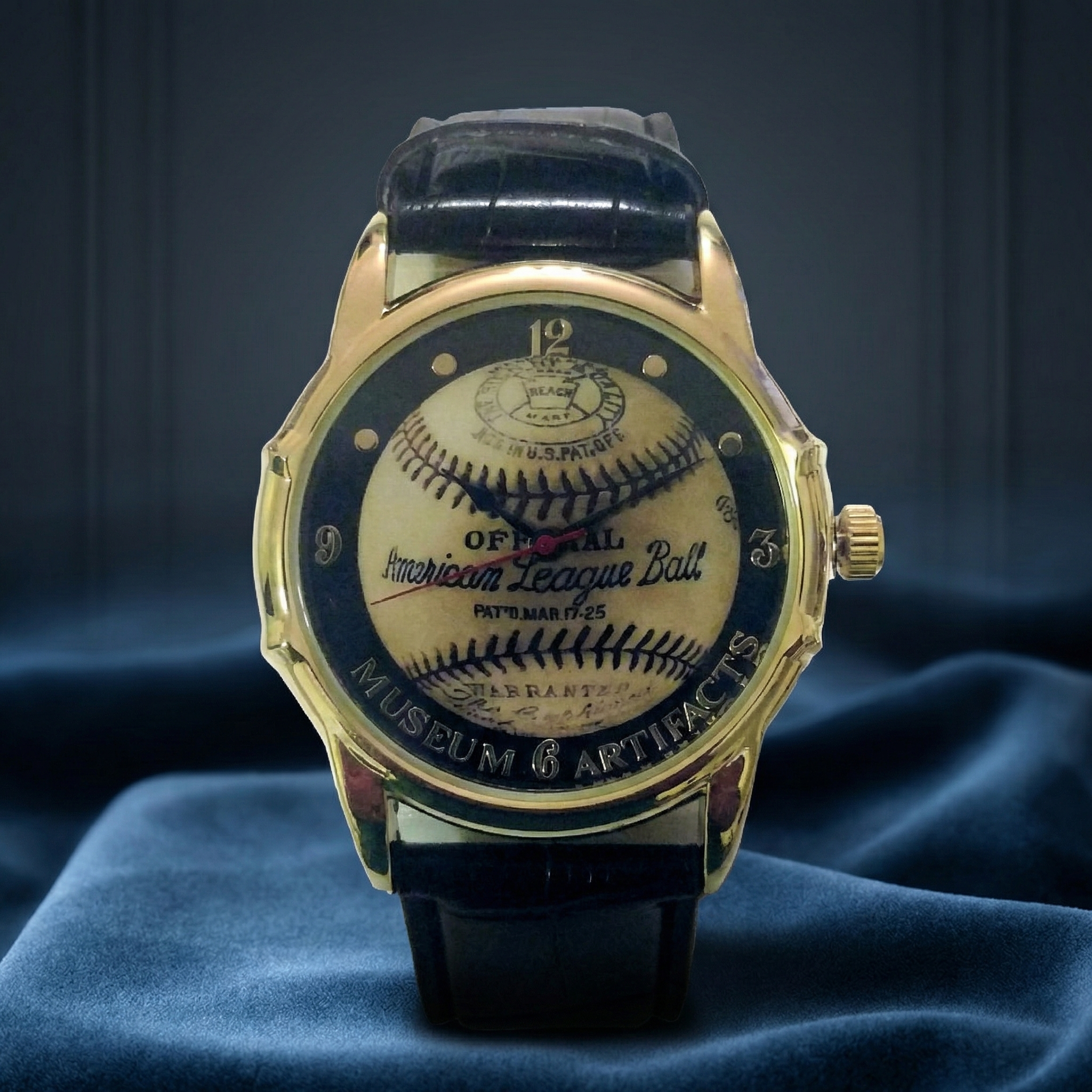 Watch with American League baseball design on the face, displayed on a blue fabric background