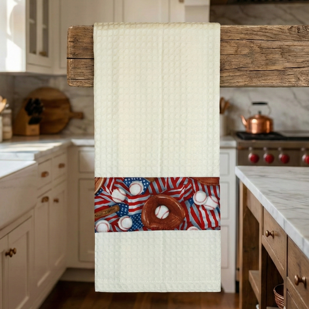 Kitchen towel with usa baseball themed design hanging on a wooden towel rack in a kitchen.