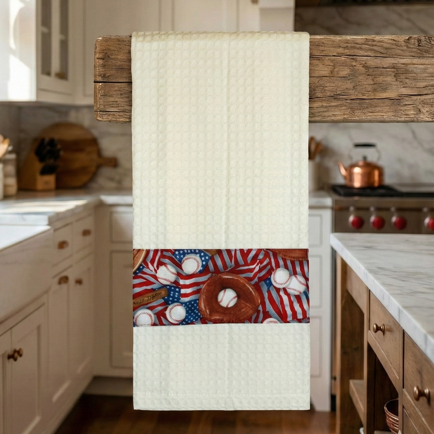 Kitchen towel with usa baseball themed design hanging on a wooden towel rack in a kitchen.