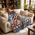 Woman lying on a couch with a decorative blanket featuring American flag and baseball design.