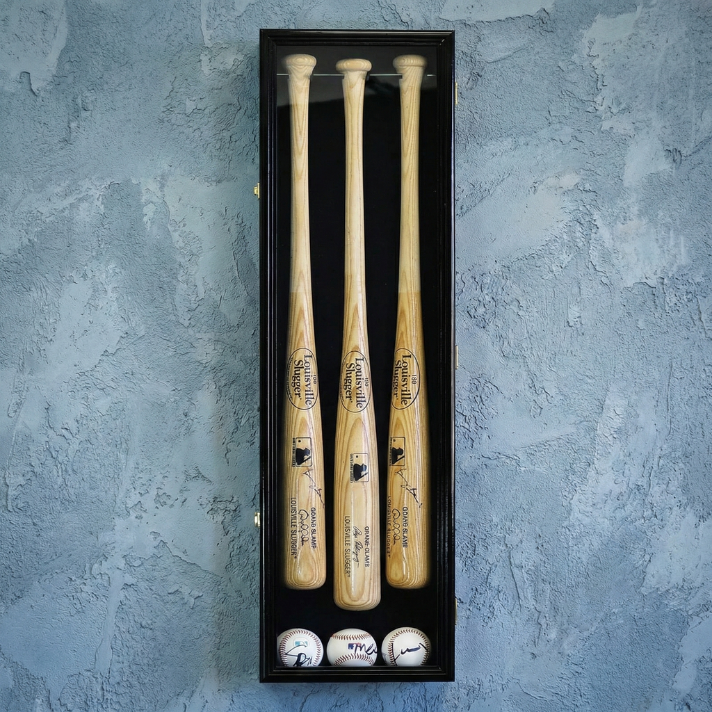 Three wooden baseball bats in a black display case with baseballs on a textured blue background