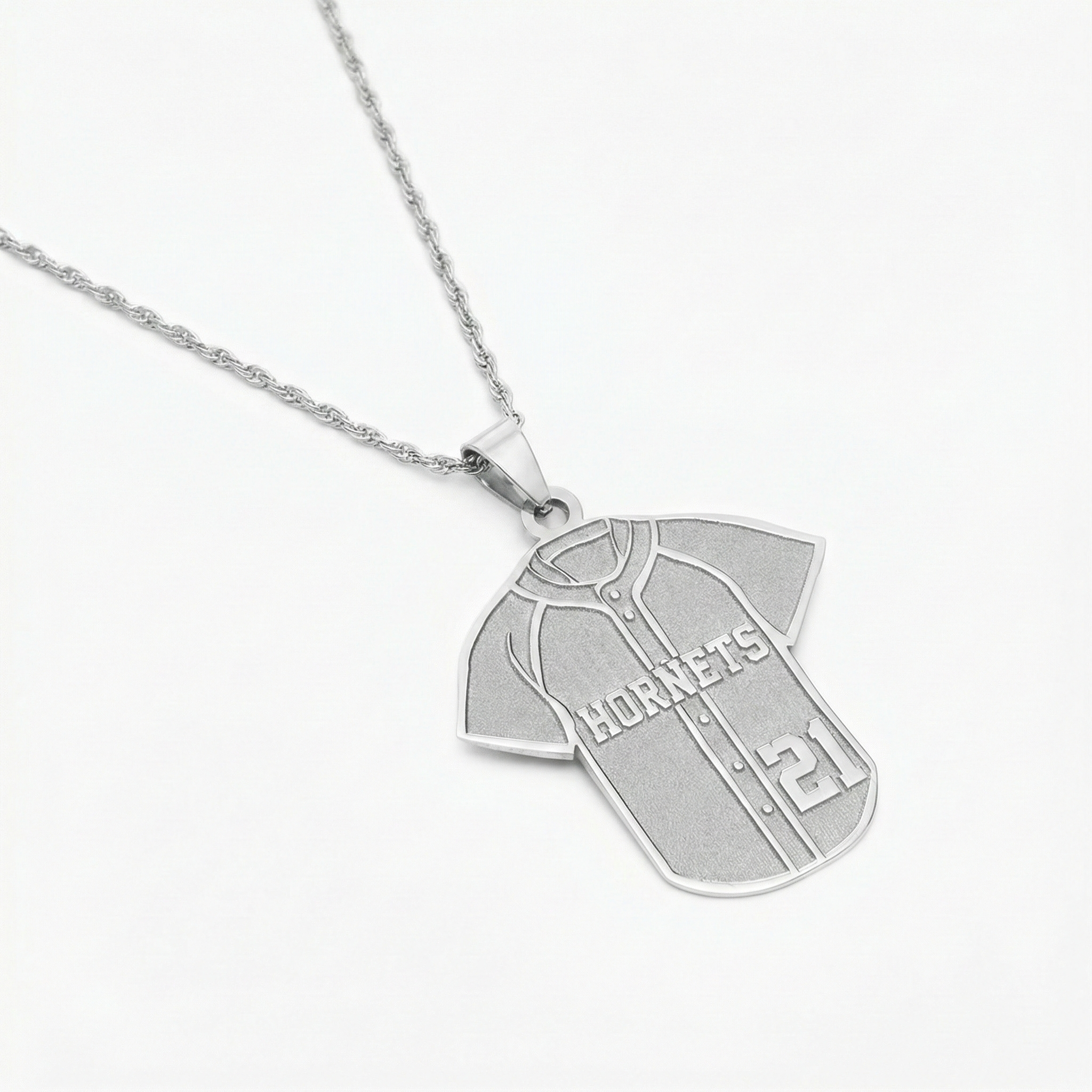 Silver baseball jersey necklace with a pendant shaped like a sports jersey on a white background
