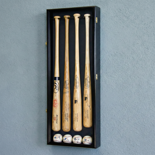 Set of four wooden baseball bats and four baseballs in a black display case against a gray wall.