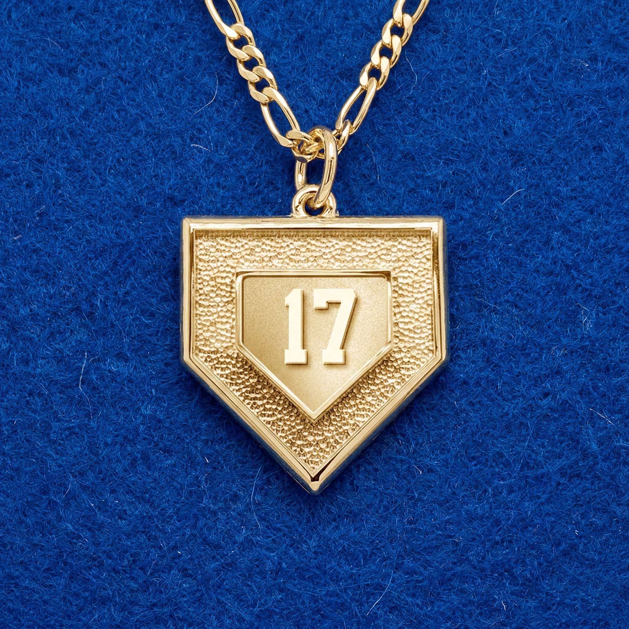 Gold necklace with a baseball number home plate pendant featuring the number 17 on a blue background
