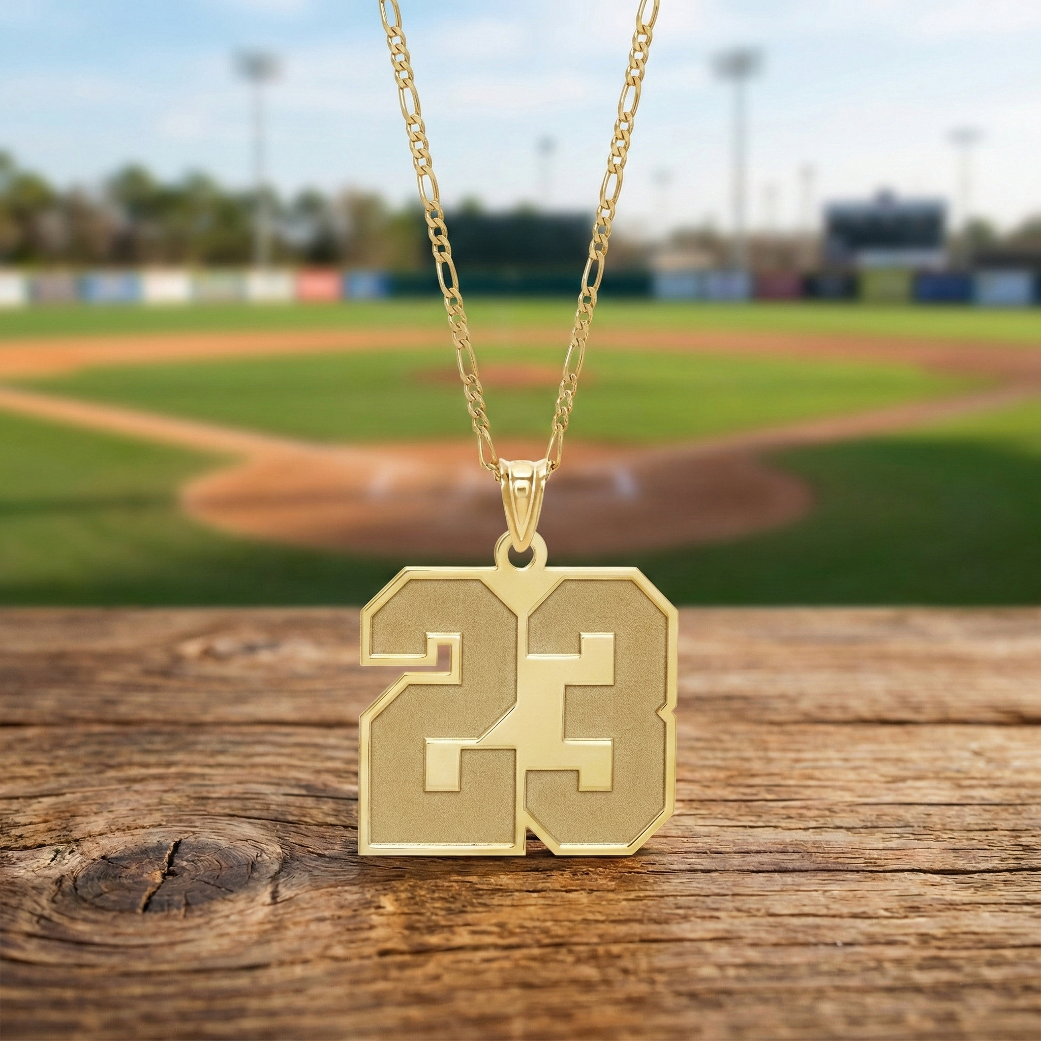 custom sports number gold necklace with 23 pendant on figaro chain. 