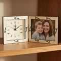 Decorative baseball clock with a photo frame showing a woman and a child on a wooden surface.