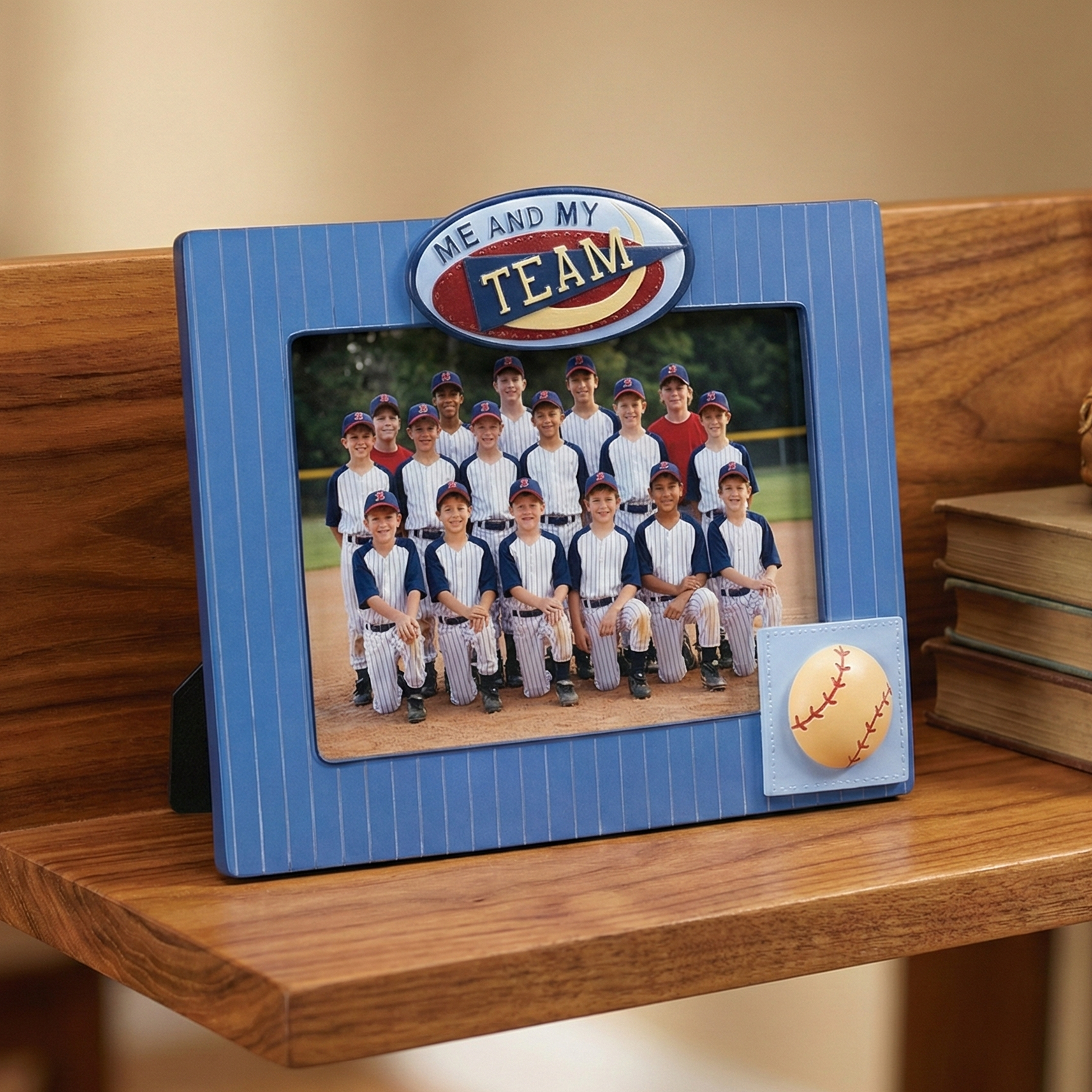 Baseball-themed picture frame with a photo of a baseball team on a wooden shelf.