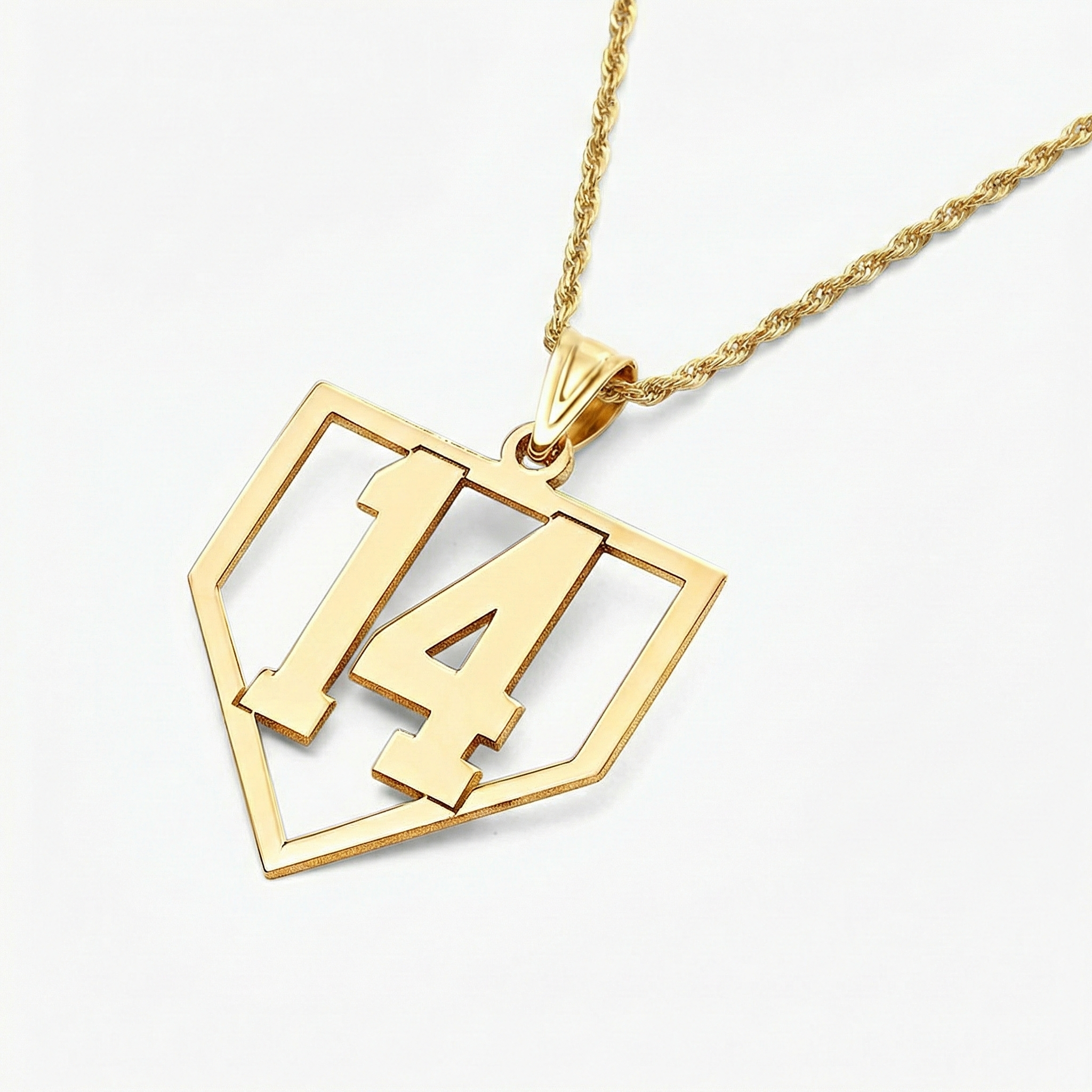 Gold necklace with a baseball number home plate pendant displaying the number 14 on a white background