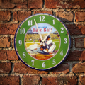 Vintage-style Big League Baseball clock with baseball design on a brick wall