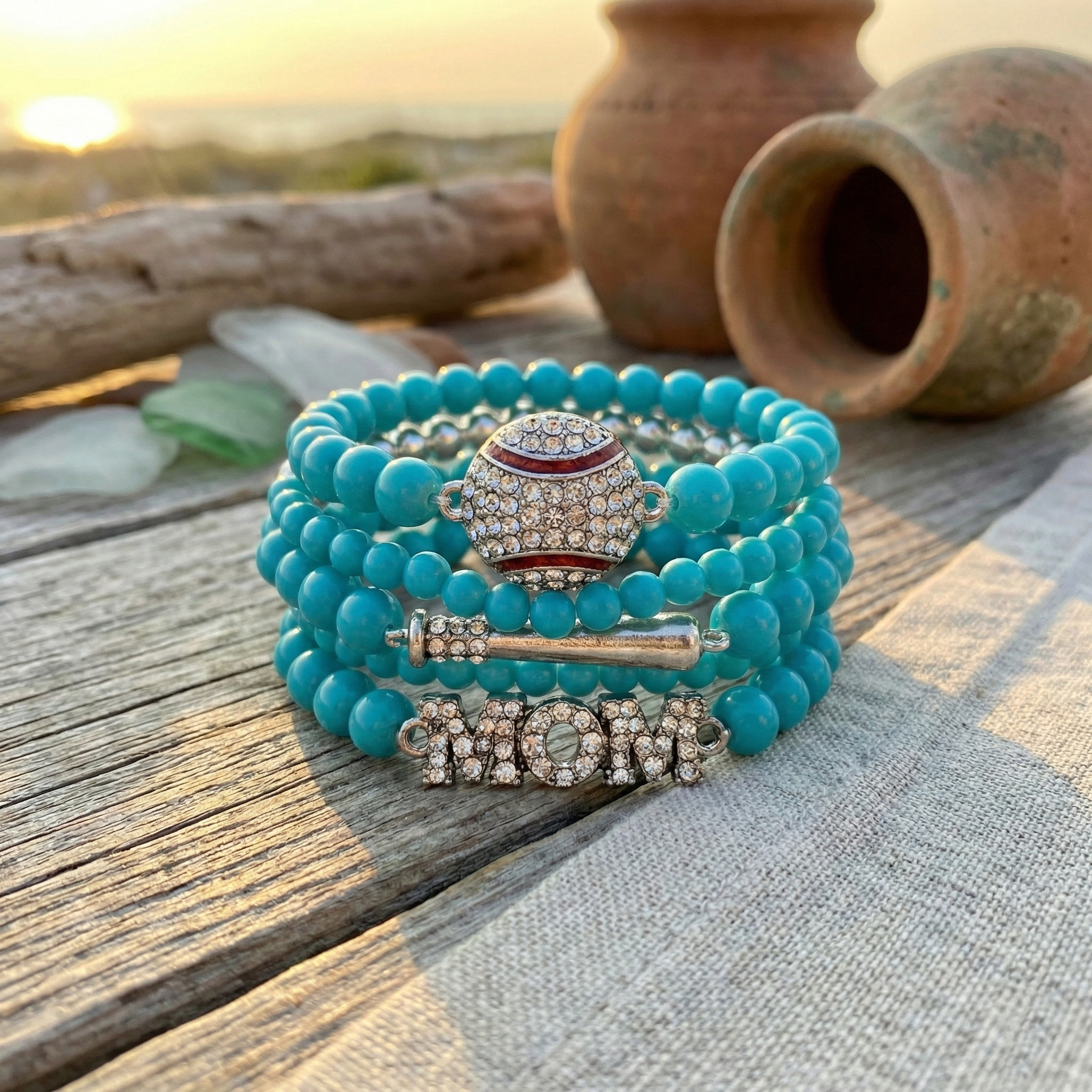 Turquoise beaded bracelets with baseball charms on a wooden surface with natural light.