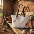 NGIL Large Baseball Canvas Tote Bag in a dugout. 