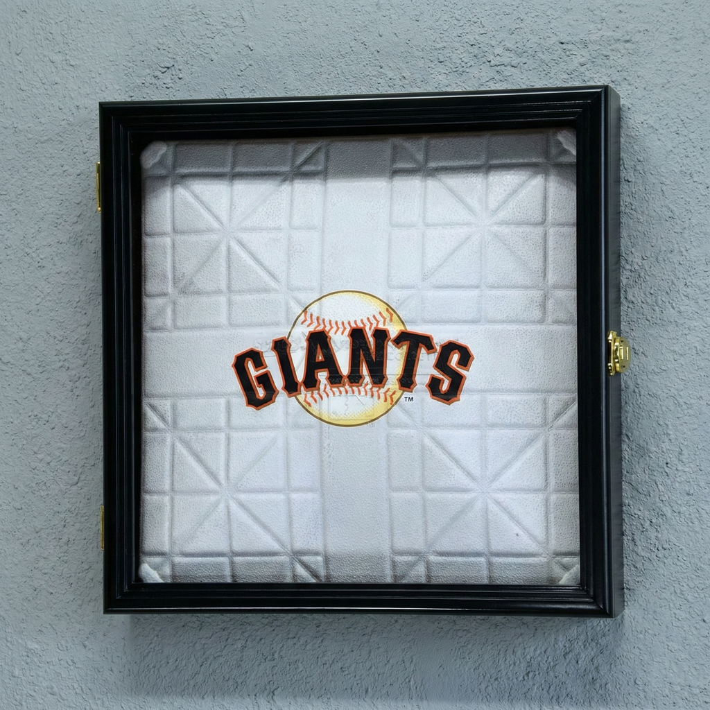 Framed baseball field base with 'Giants' logo on a gray wall