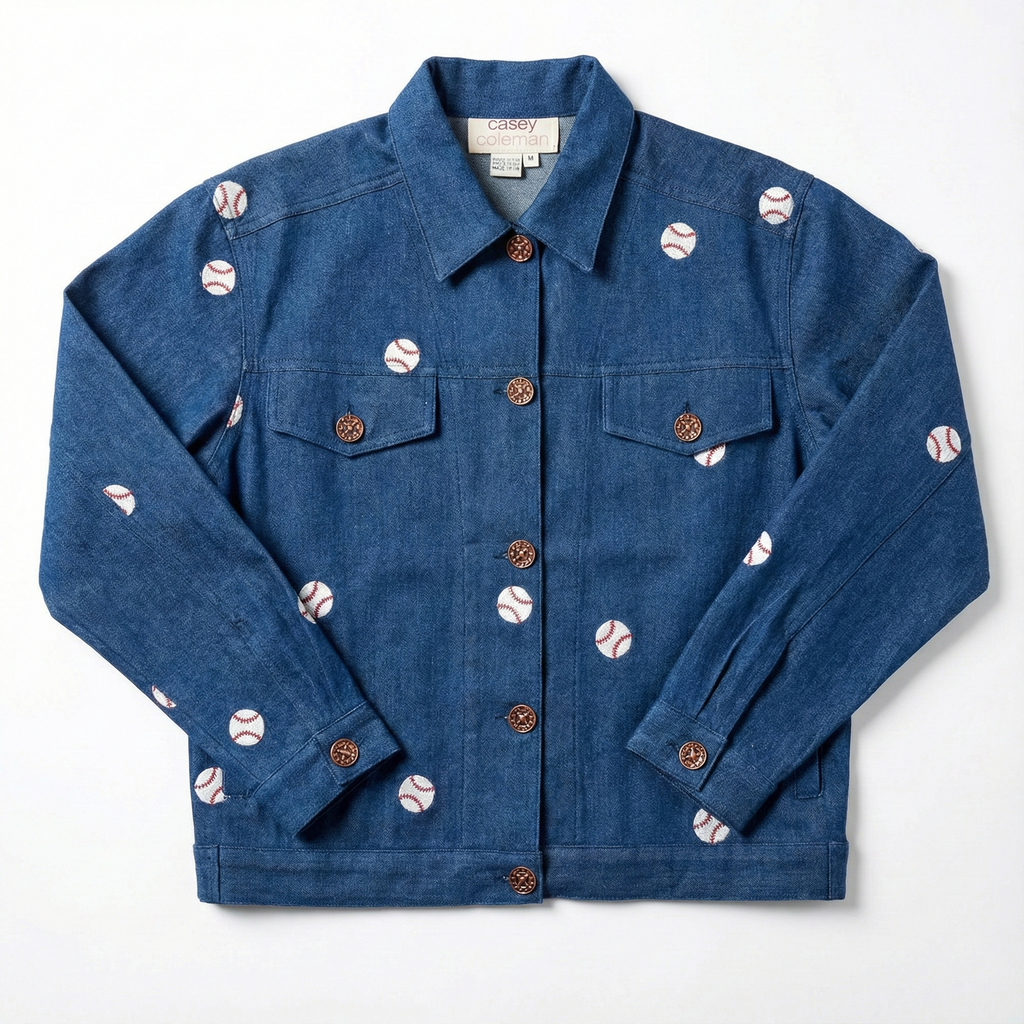 Blue denim jacket with baseball-themed buttons on a white background