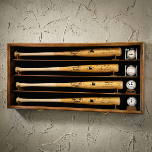 Set of Louisville Slugger baseball bats and balls in a wooden display case against a textured wall.