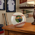 round baseball photo frame holding a baseball picture inside a fan cave of collectibles.