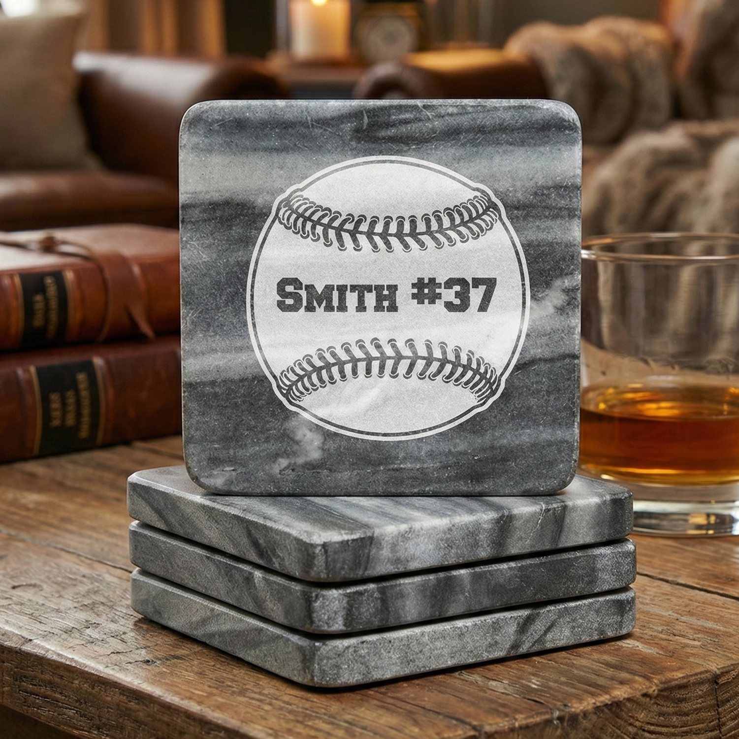 Set of gray marble coasters with baseball design and 'Smith #37' text on a wooden surface.