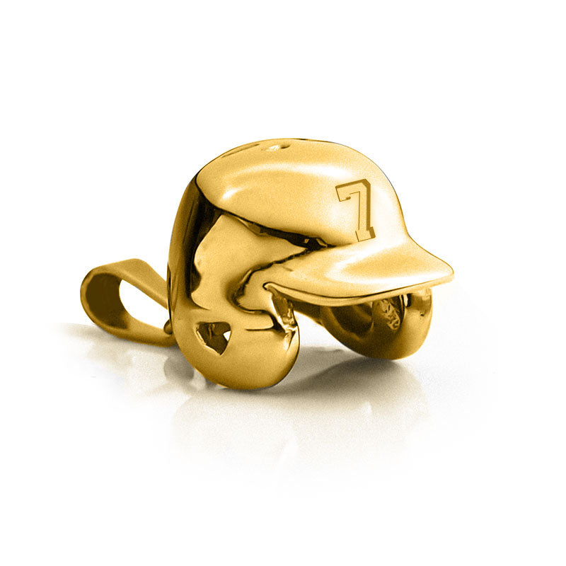 Gold baseball helmet charm on a white background