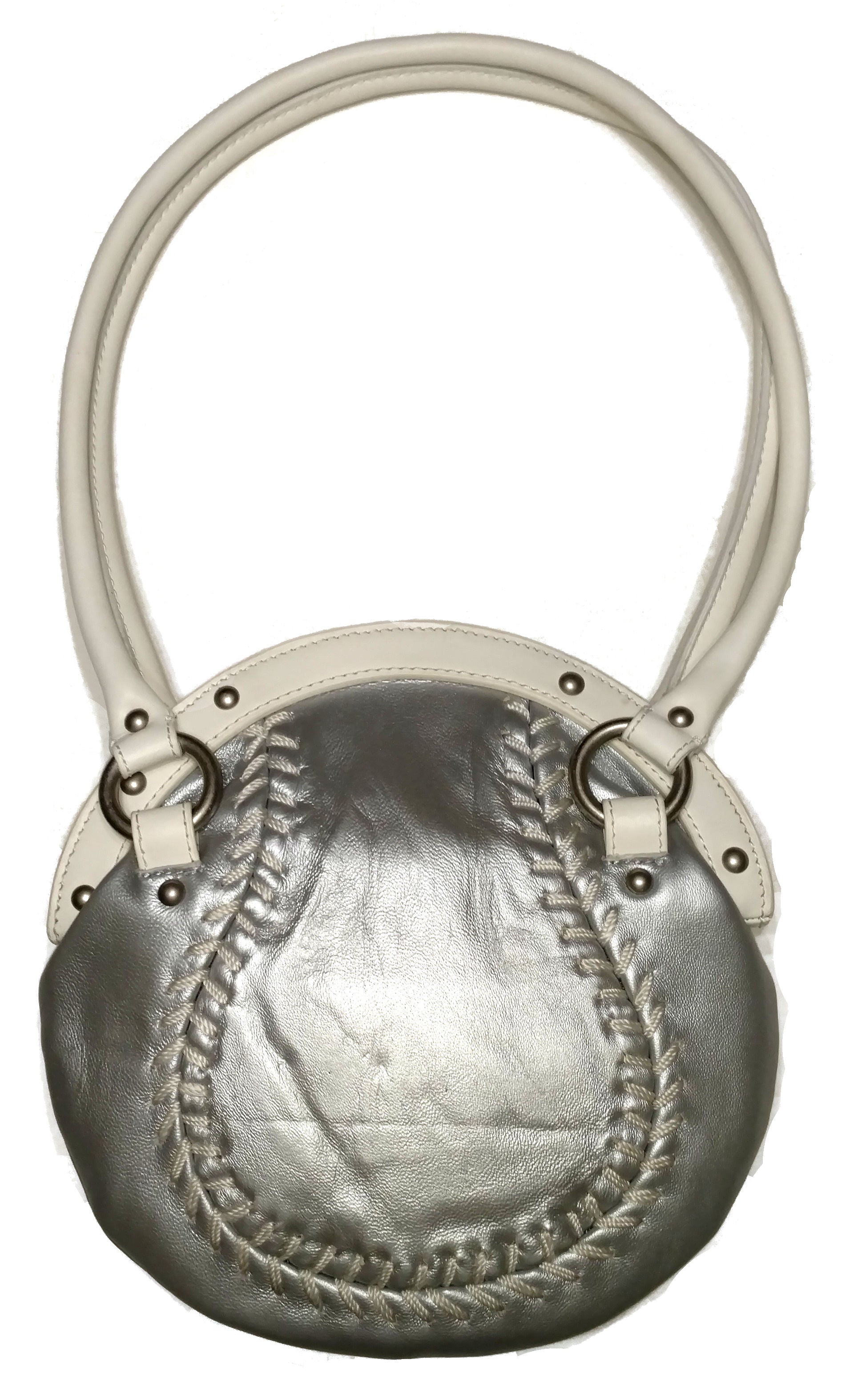 Metallic silver baseball handbag with textured surface and leather handle on a white background