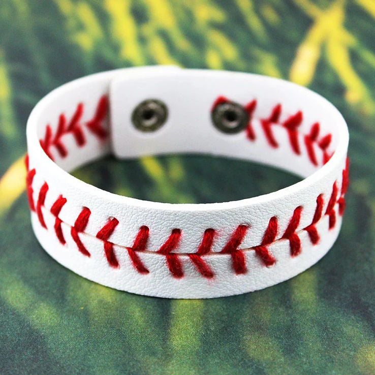 baseball stitch cuff bracelet on grass background