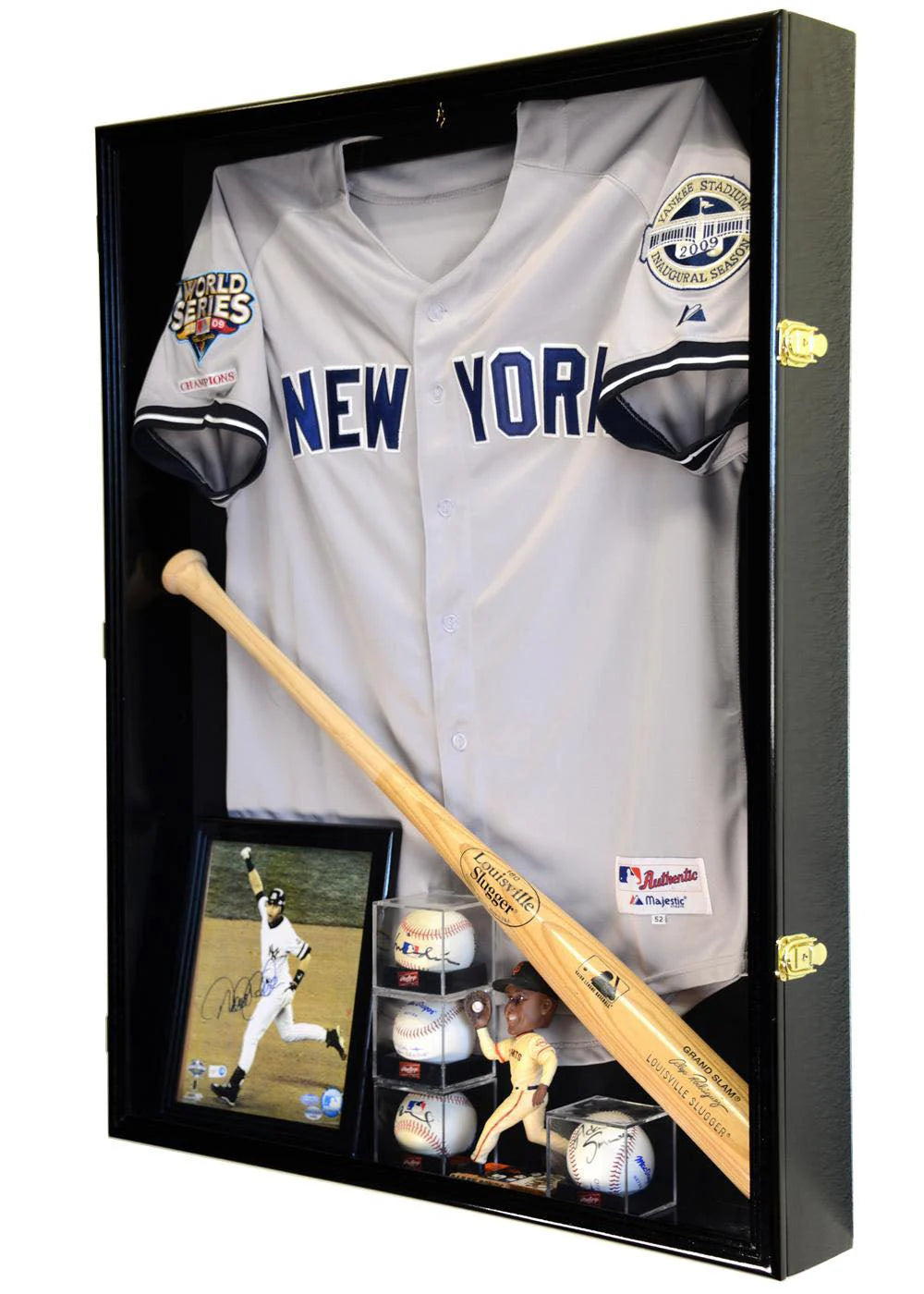 Baseball jersey, bat, and memorabilia in a shadowbox display case with a black frame.