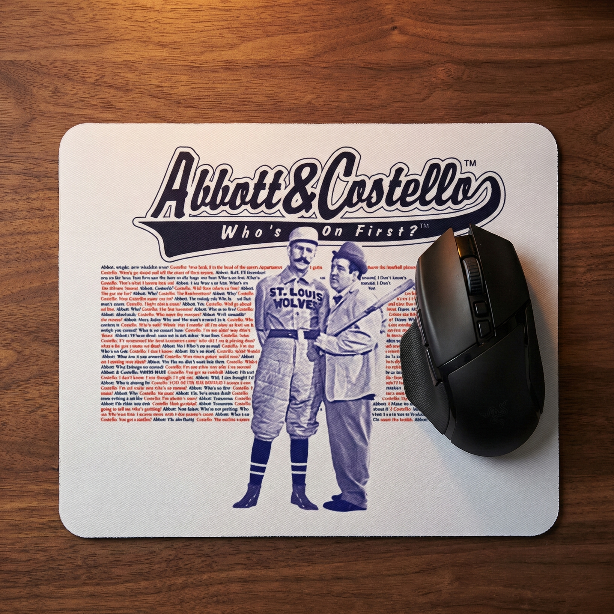 Mouse pad with Abbott & Costello design on a wooden surface