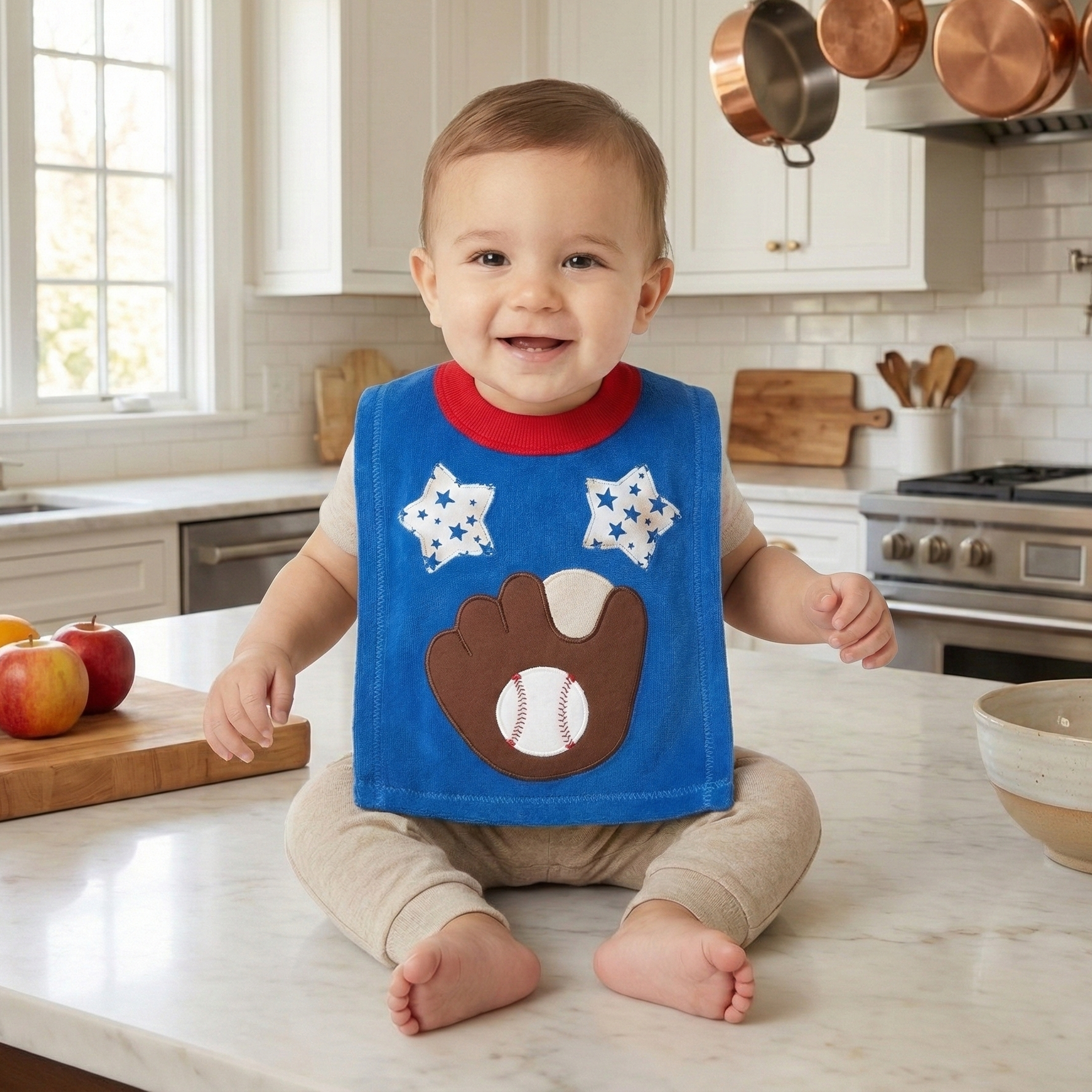 baby in the kitchen with a pullover baseball bib.