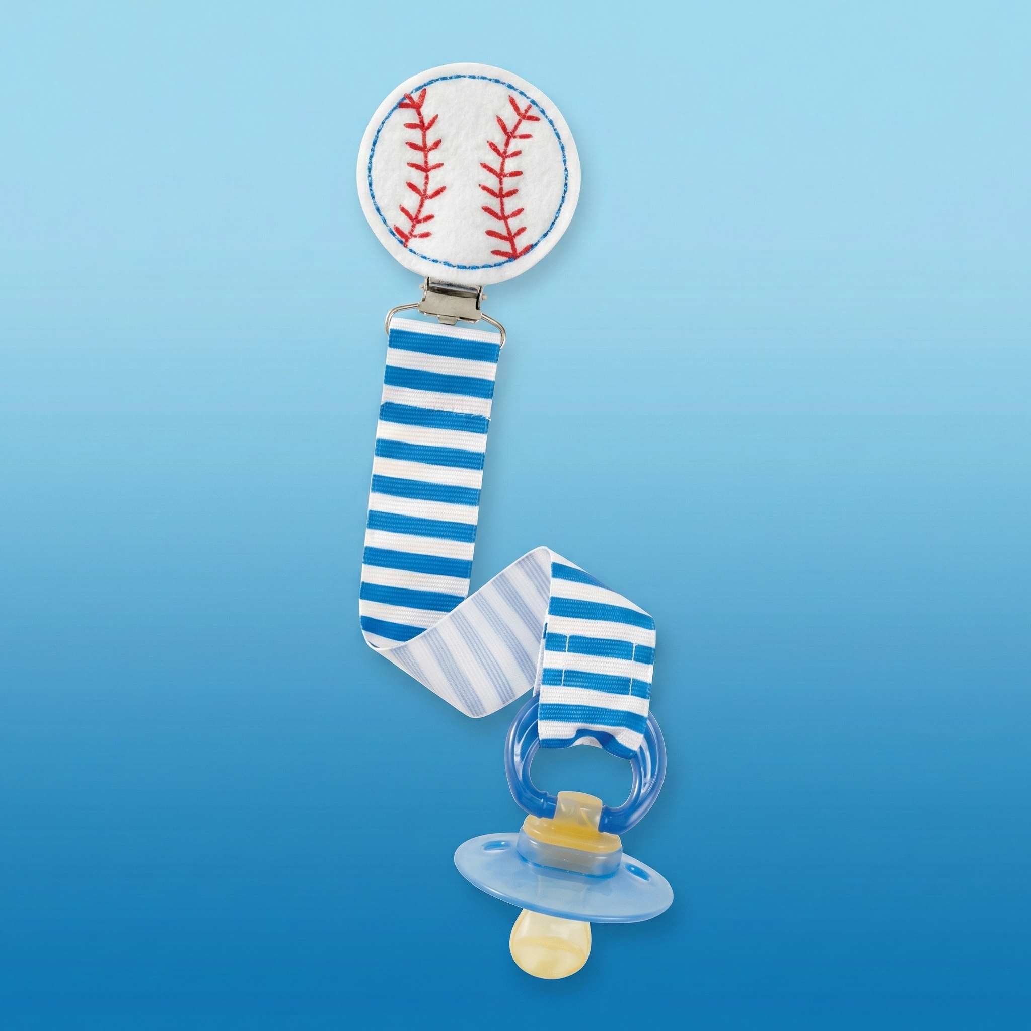 Mud Pie Baseball Baby Pacifier Clip on blue background.