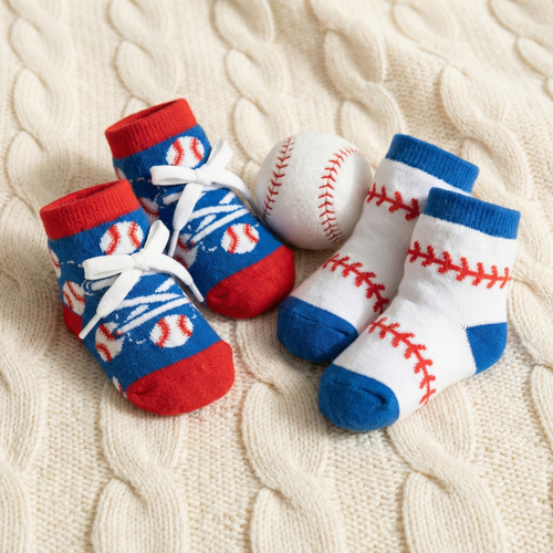 2 pairs of baseball baby socks on a baby blanket
