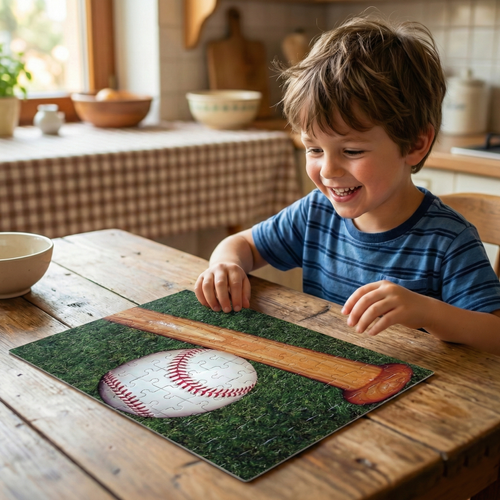 Child playing with a baseball and bat puzzle on a wooden table.