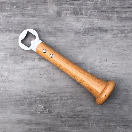 Wooden-handled baseball bat bottle opener on a gray surface