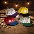 Set of Four Ceramic Baseball Cap Dip Bowls on a table with bat, glove, and peanuts.