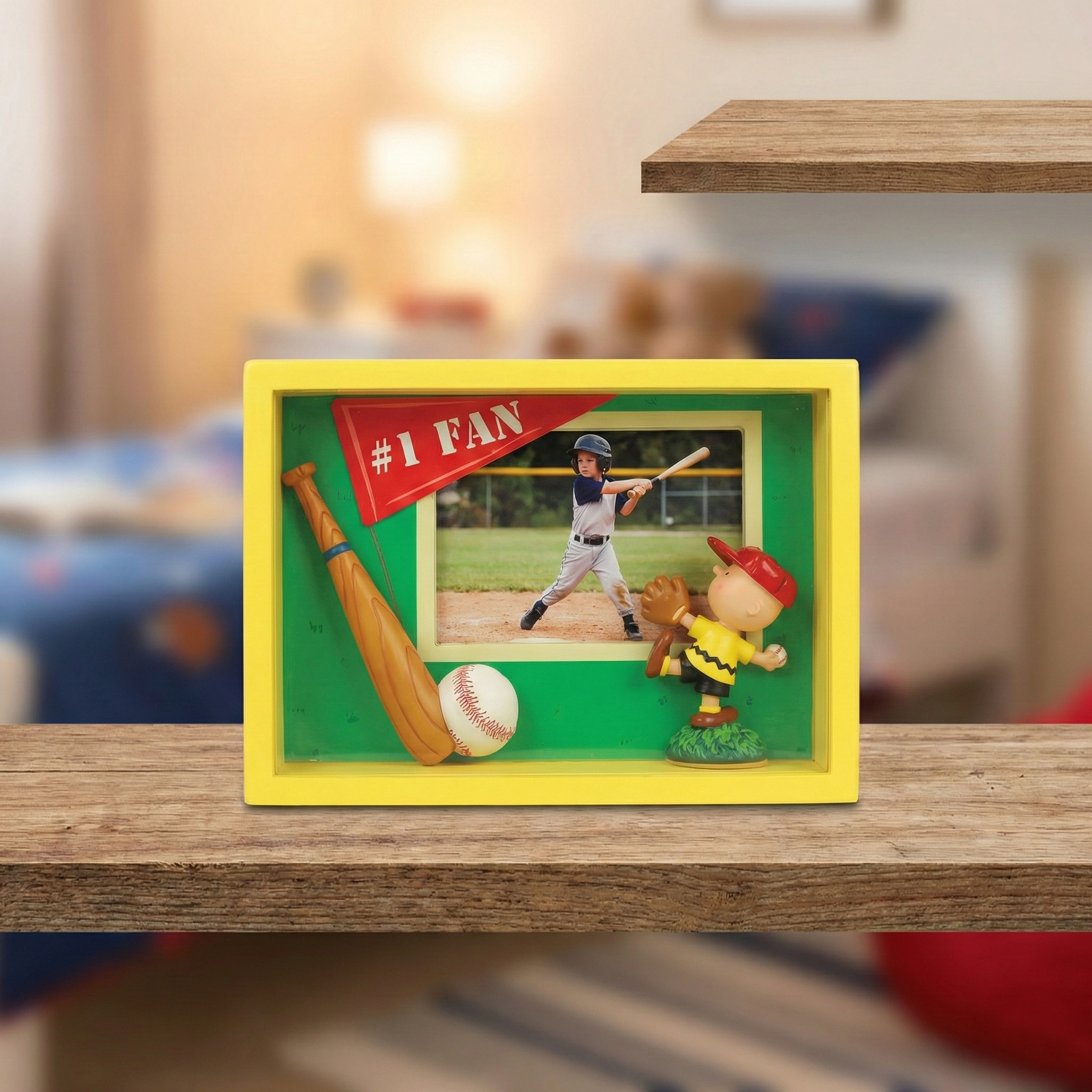 Charlie Brown Peanuts #1 Fan Shadow Box Baseball Frame on a wooden shelf in a kids room