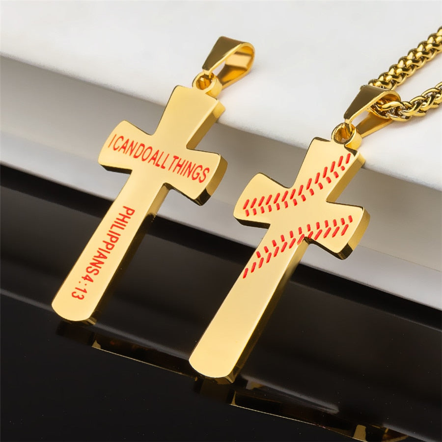 Gold baseball cross pendants on a reflective surface with a white background