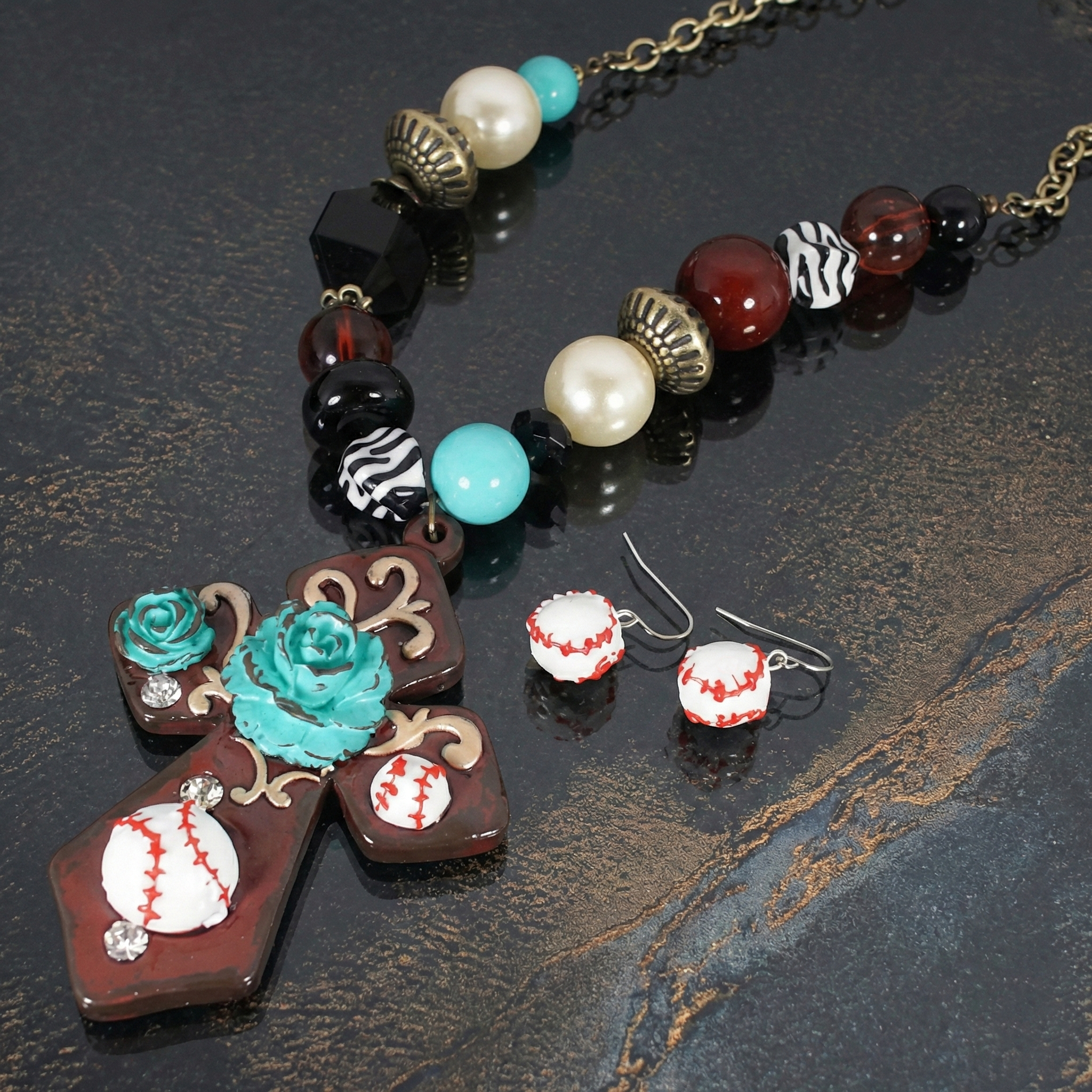 Cross and Baseball Rock Beaded Necklace Set on a dark background