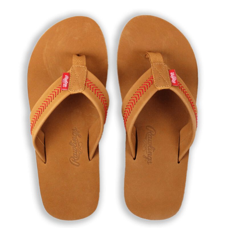 Pair of tan sandals with red stitching on a white background