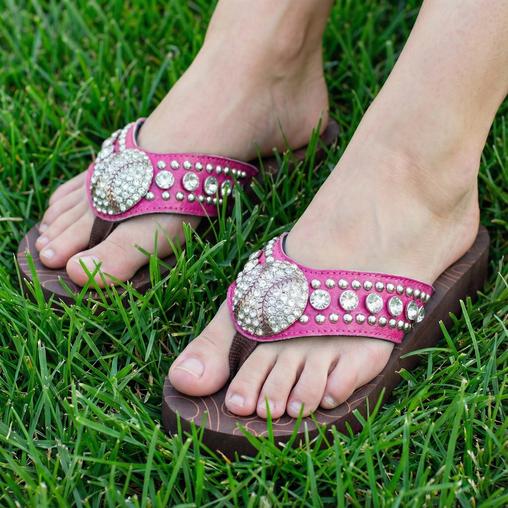 Montana West pink baseball sandals with embellishments on grass.
