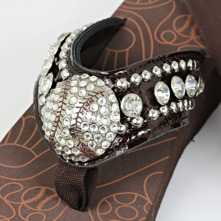 Brown shoe with baseball decorative embellishments on a white background
