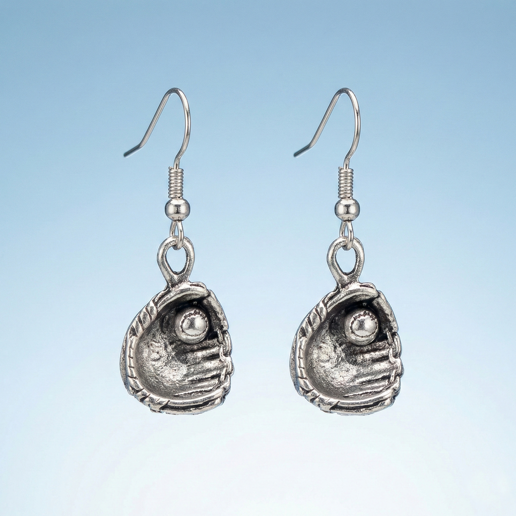 Pair of silver baseball glove earrings on a light blue background