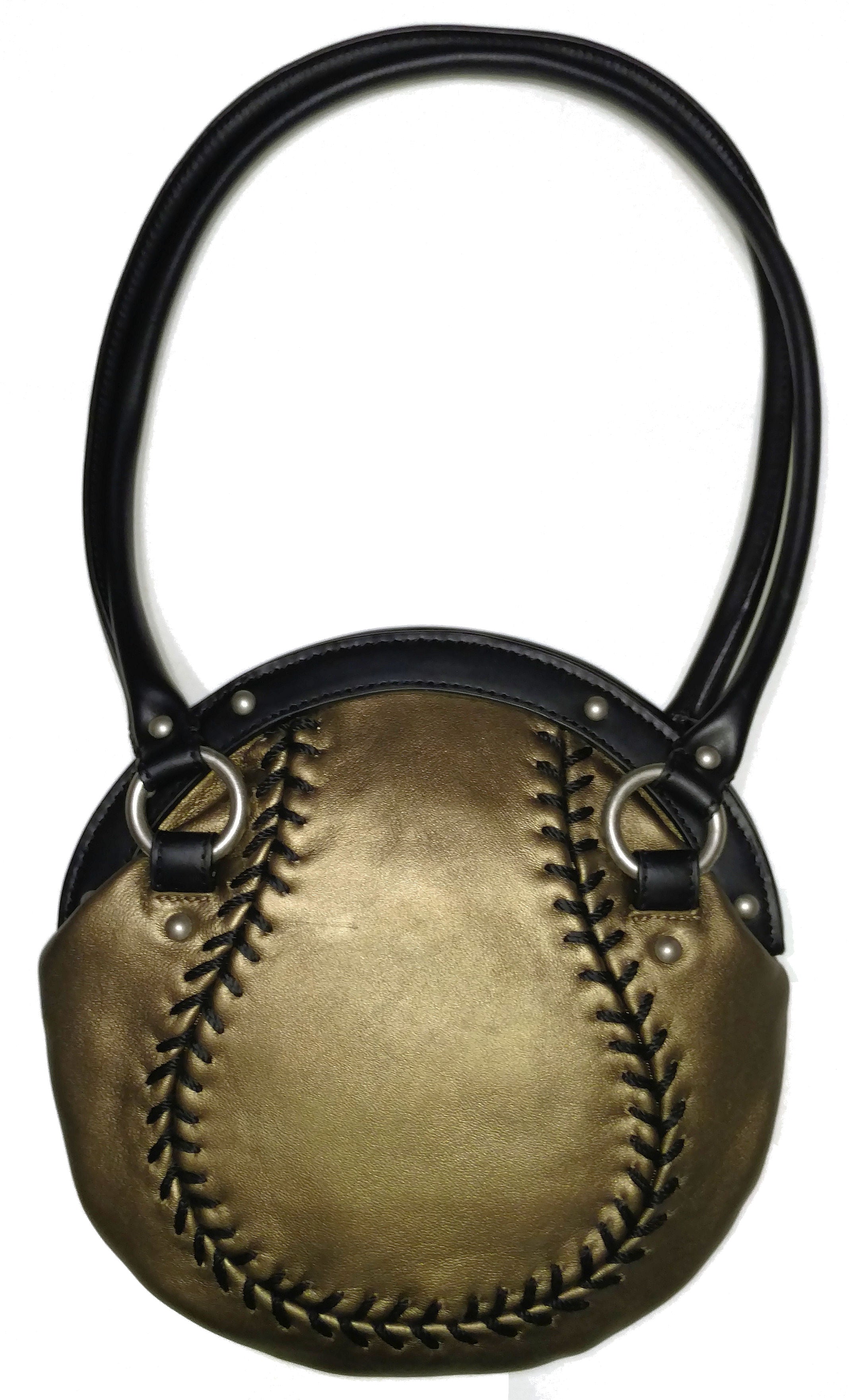 Gold leather handbag designed like a baseball with a black handle on a white background