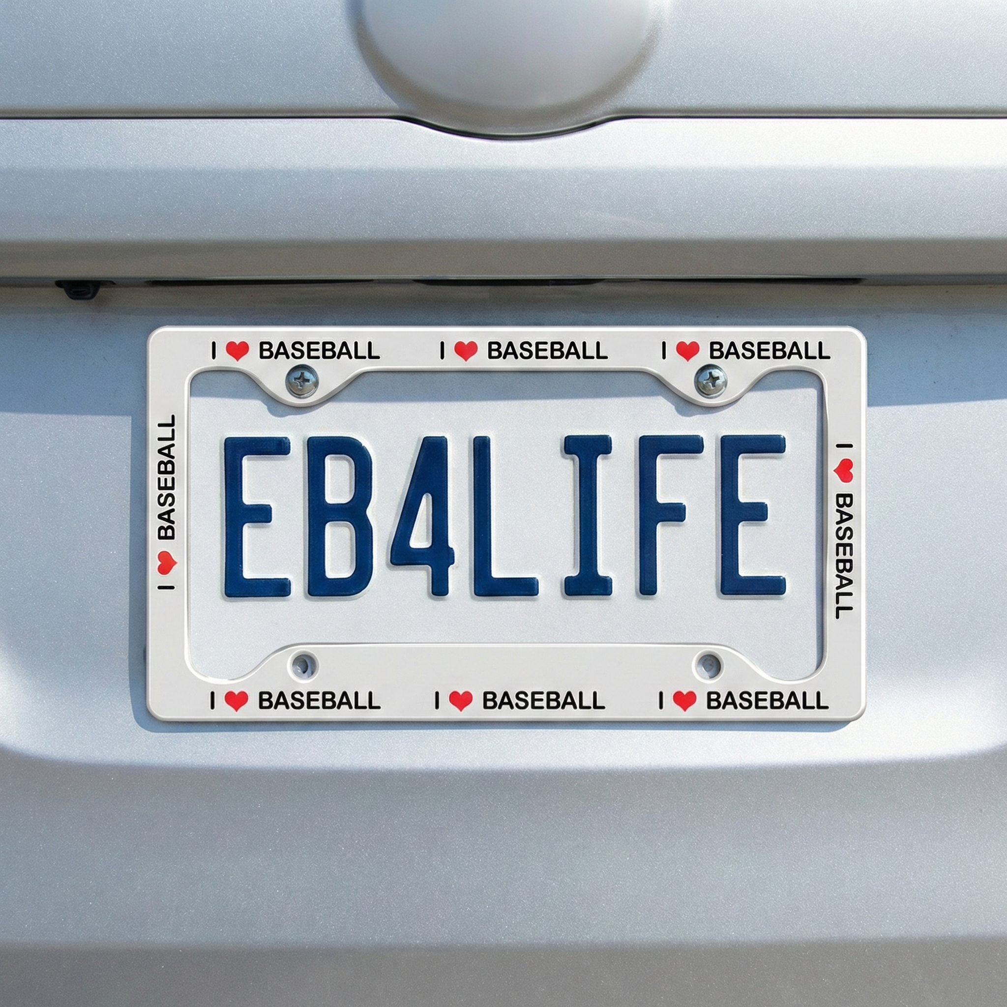 Car license plate with 'EB4LIFE' text and 'I ❤️ BASEBALL' auto tag frame on a vehicle.