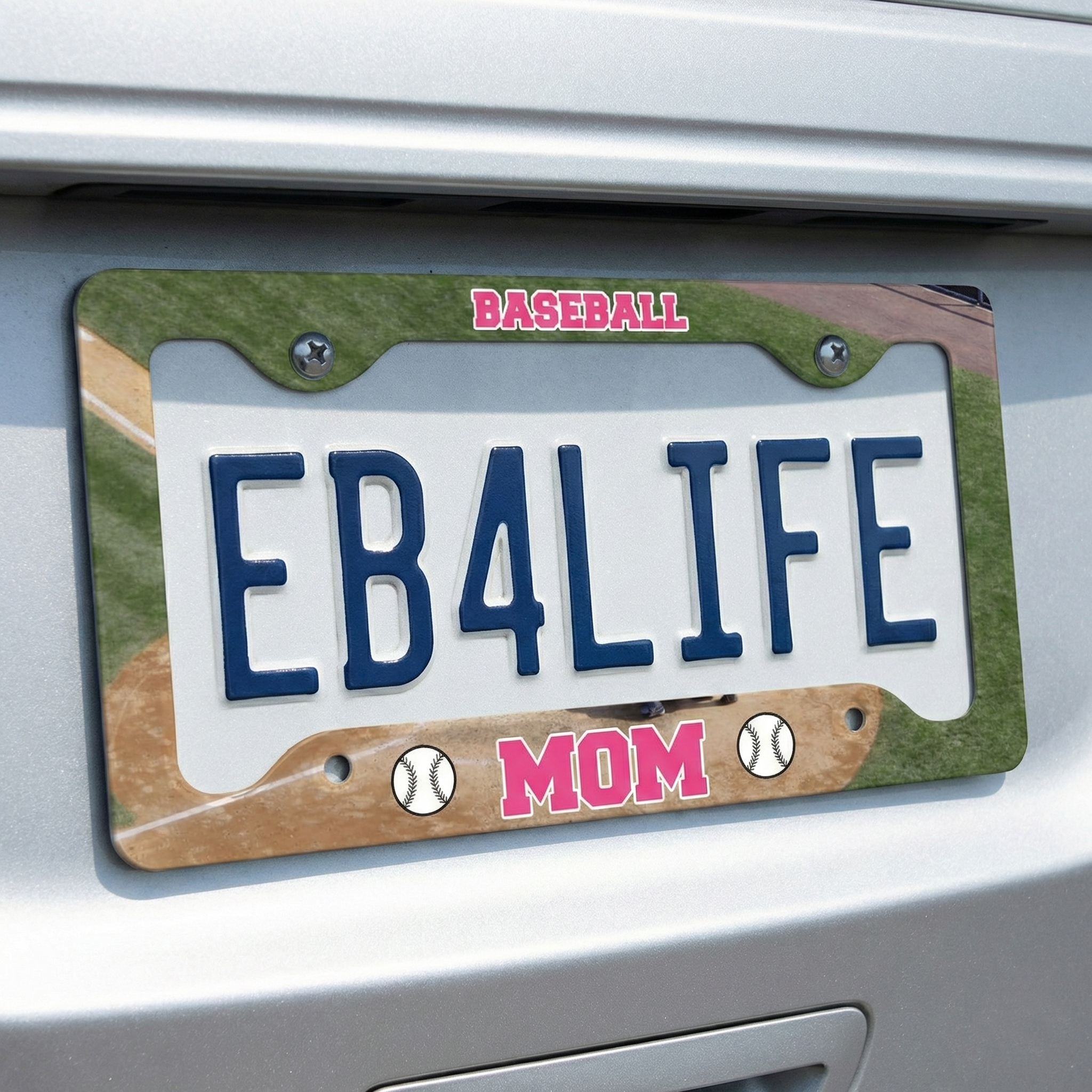 License plate with 'EB4LIFE' and 'BASEBALL MOM' auto tag frame on a car