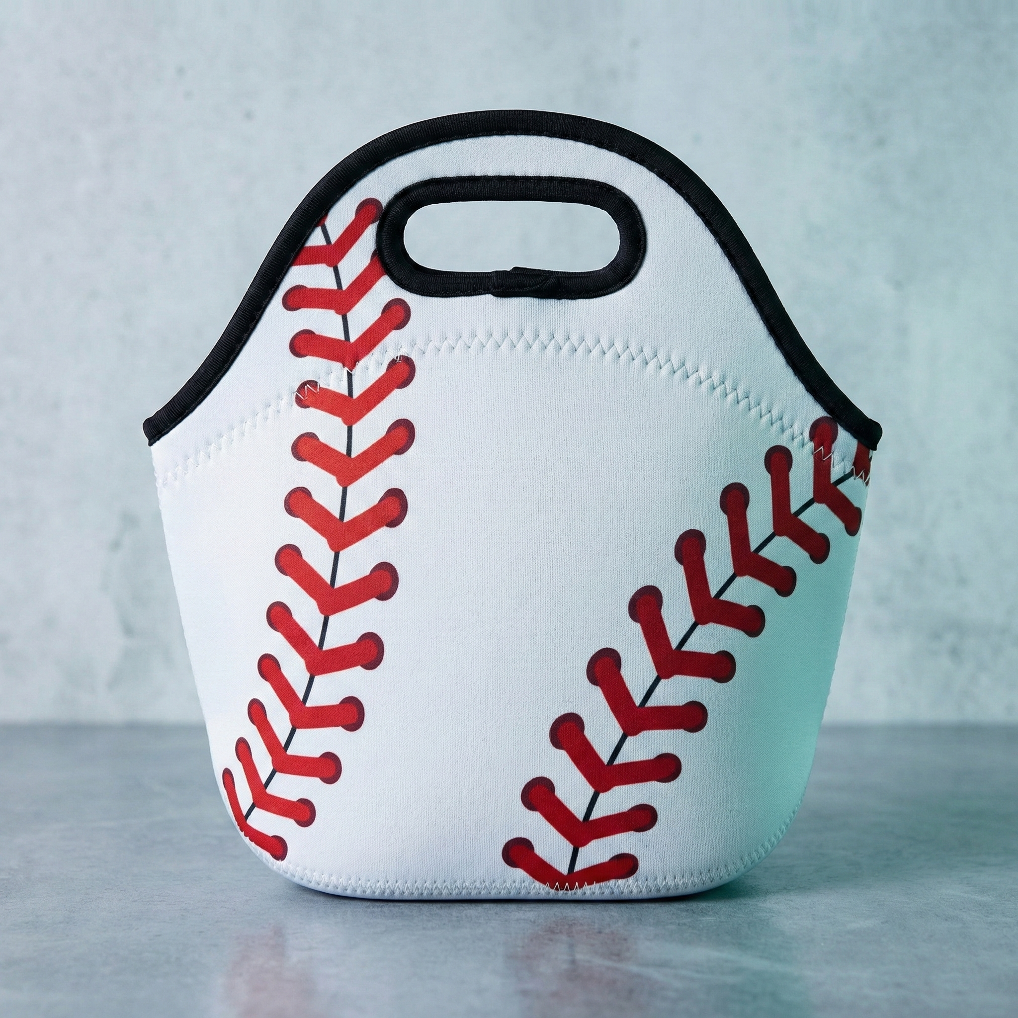 Baseball Laces Lunch Tote in a studio. 
