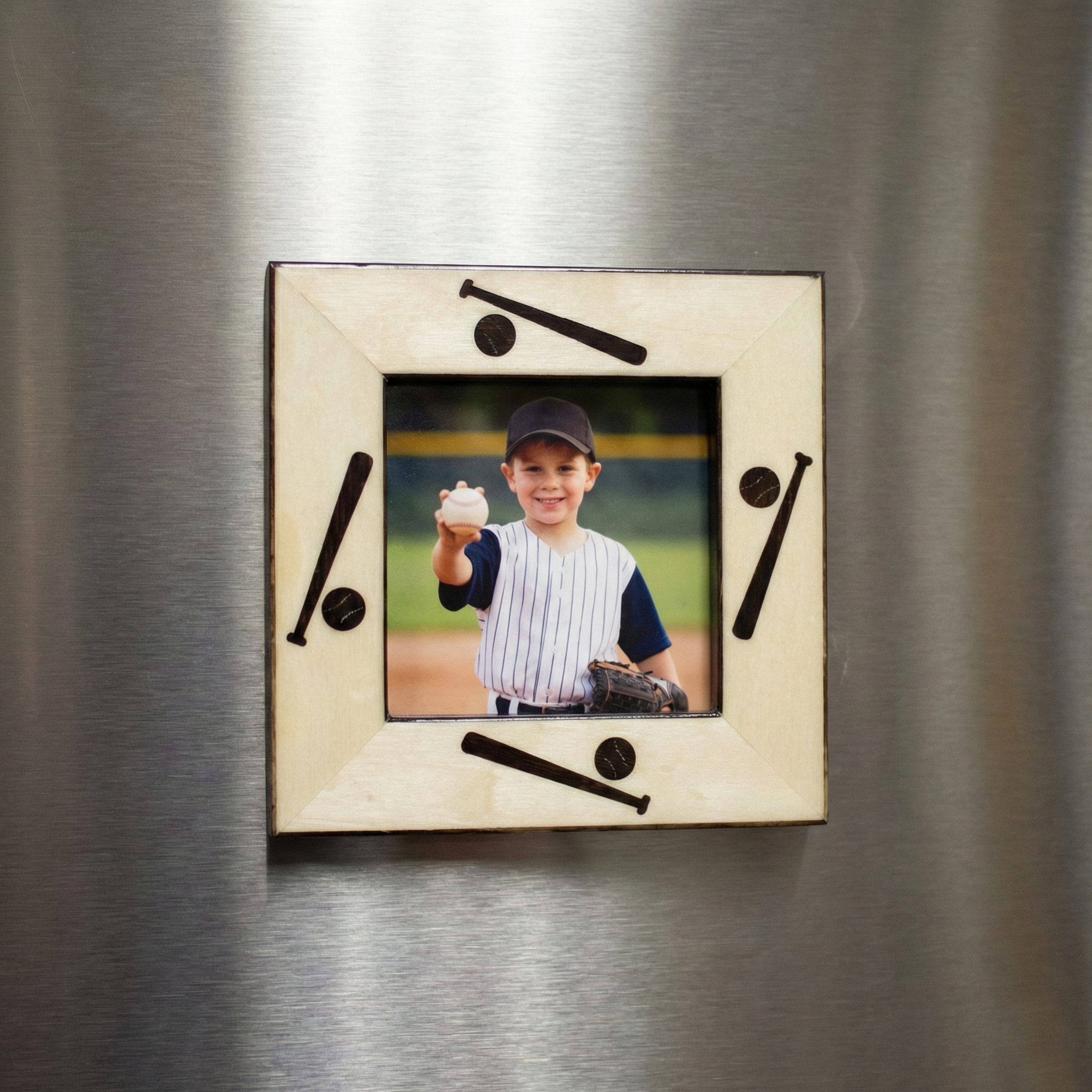 Wooden photo frame magnet with baseball design on a metallic surface