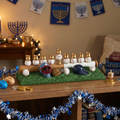 Baseball-themed menorah with Jewish sports-themed decorations on a table.